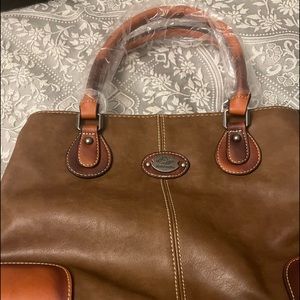 New brown bag.  I was given this and not familiar with the brand.  New